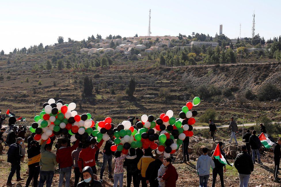 Palestinians protest near the settlement of Psagot in the occupied West Bank on 18 November 2020
