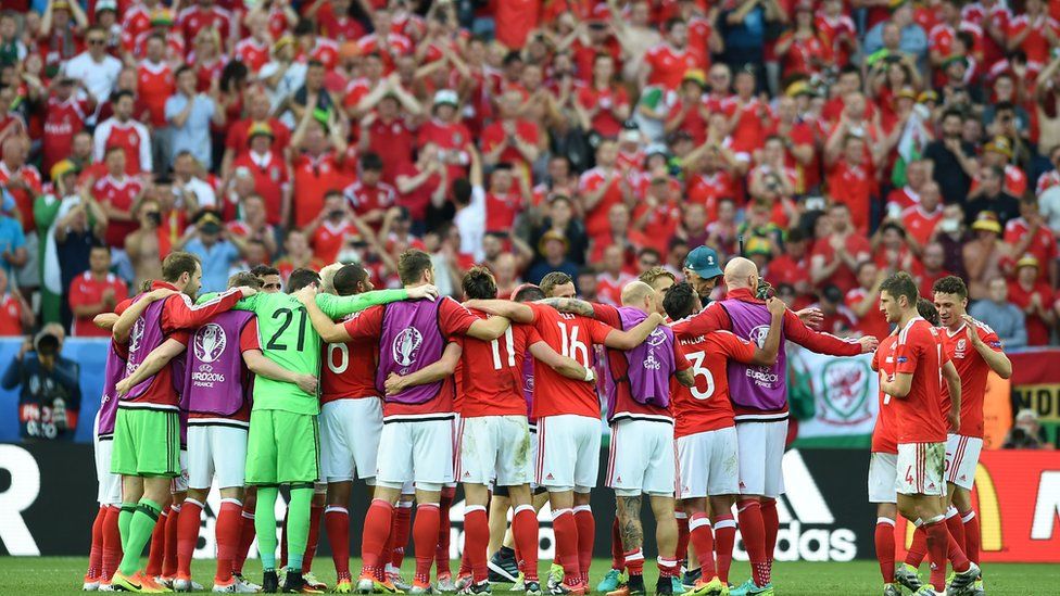 Wales' football team and Welsh fans celebrate their opening win at Euro 2016