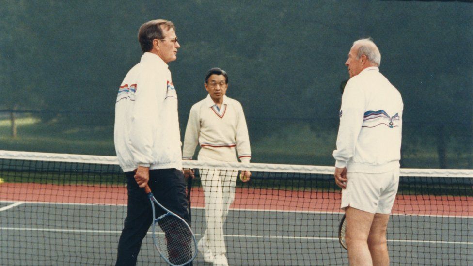 Crown Prince Akihito (C) plays tennis with US Vice President George H.W. Bush (L) and Secretary of States George Shultz (R