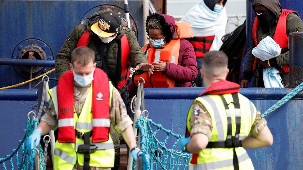 Migrants arrive in Dover on Thursday after being rescued while crossing the English Channel