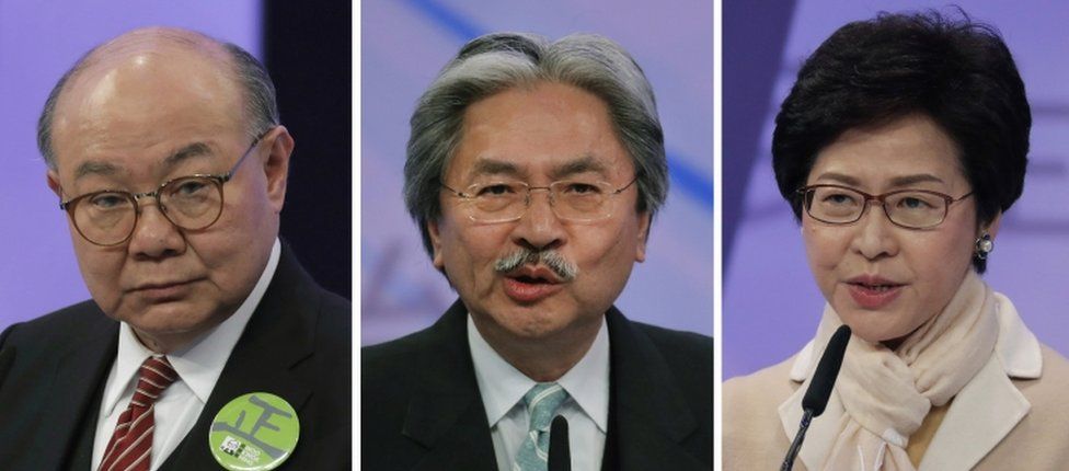 This combination of three file photos taken Tuesday, 14 March 2017, shows Hong Kong chief executive candidates, from left, former judge Woo Kwok-hing, former Financial Secretary John Tsang and former chief secretary Carrie Lam, speaking during a chief executive election debate in Hong Kong