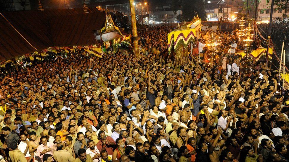 Hindu devotees pray at the Sabarimala temple during the Maravilakku festival marking the final of a two-month pilgrimage to the Lord Ayyappa temple in Kerala, south India on January 14, 2011.