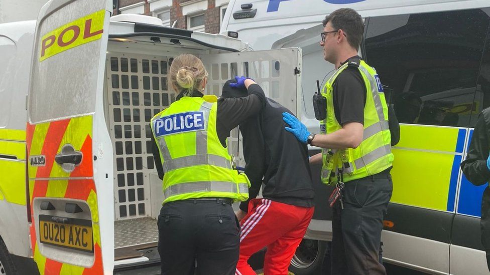Bedfordshire Police officer arresting a man