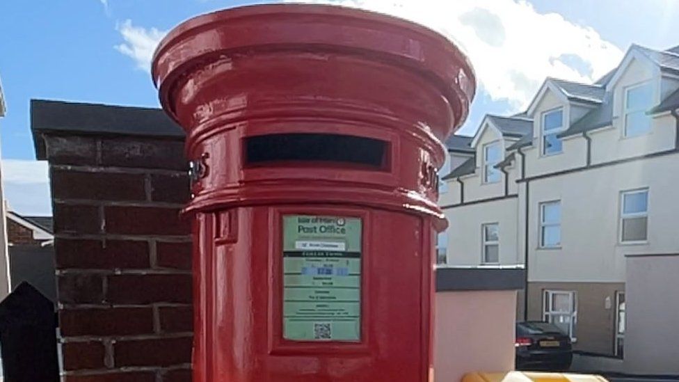 Red post box in Onchan