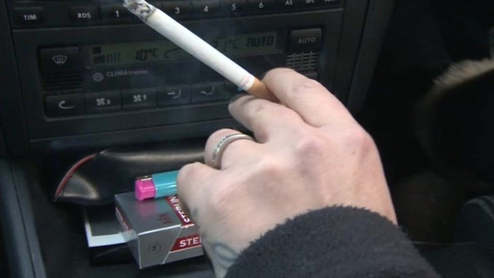 Woman smoking in car (generic)