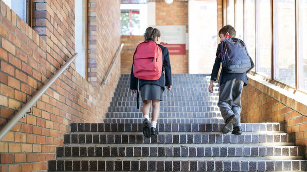 Stock image of children at school in uniform