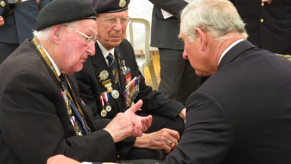 John Ainsworth, left, and Ray Lord meet the then Prince of Wales during D-Day commemorations in France