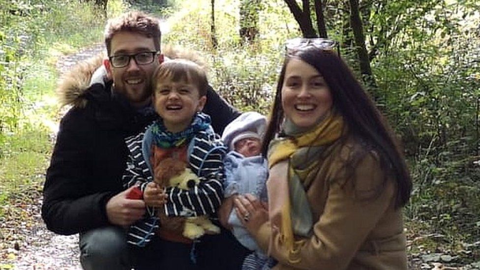 Sara, Andrew and their two children Ezra and Eliza in woodland path
