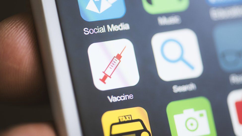 A smartphone screen shows a mock-up of a vaccine app