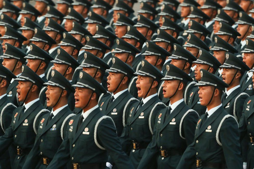 Soldiers of the People's Liberation Army shout during the rehearsal of the parade on the morning of 1 October 2019, in Tiananmen Square, Beijing.