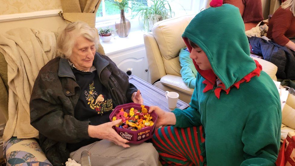 Oscar delivering chocolates to residents