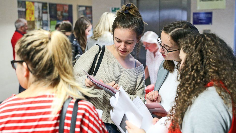 Students checking A-level results at Peter Symonds College, Winchester