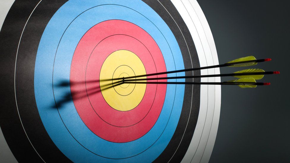 Three arrows in an archery target