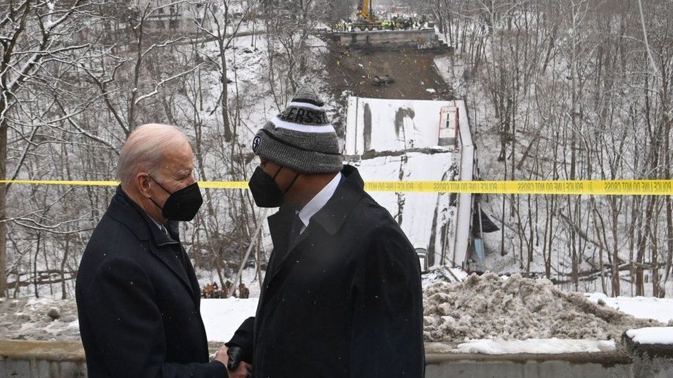 President Biden speaks with Pittsburgh Mayor Ed Gainey at the scene of the collapsed bridge