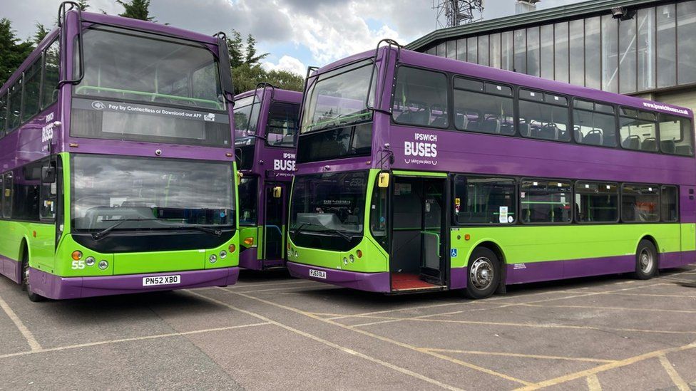 Double decker buses in green and purple livery of Ipswich Buses