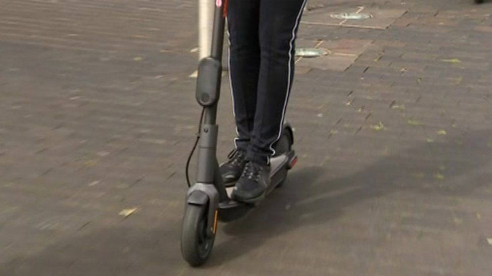 Man on e-scooter