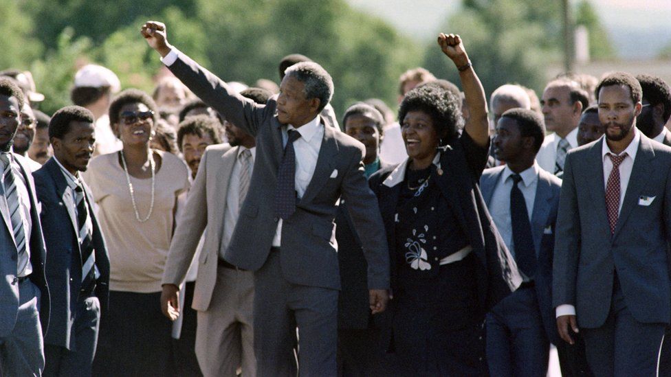 Former South African President Nelson Mandela (centre) with his wife Winnie following his release from Victor Verster prison on 11 February 1990