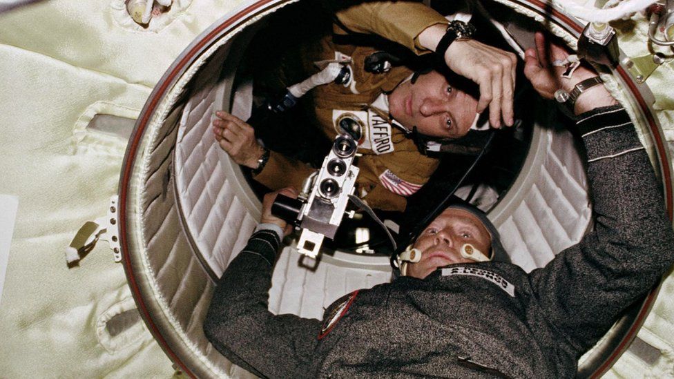 Astronaut Thomas Stafford and cosmonaut Aleksei Leonov meeting in space