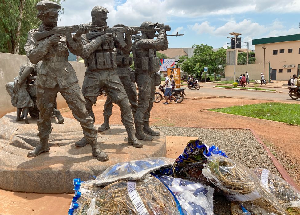Statue of Russian troops in Bangui, Central Africa Republic with floral tributes