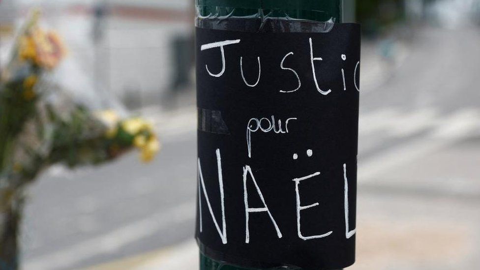 Flowers and message are seen at the site where Nahel, a 17-year-old teenager, was killed by a French police officer during a traffic stop, in Nanterre, Paris suburb, June 29, 2023.