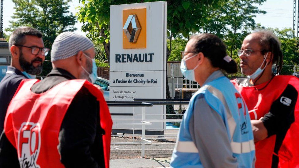 Employees of French carmaker Renault gather near one of its Paris sites to protest