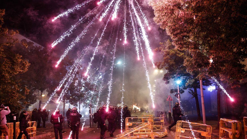 Protesters throw fireworks at riot police in Nanterre, 29 June 2023