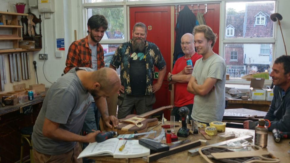 Participants in the Nailsworth workshop building a guitar
