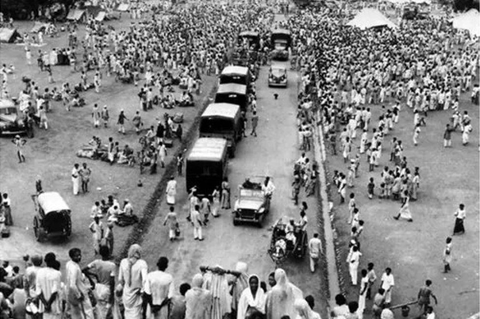 In September, 1947, Muslims gather as they as they seek protected transport to Pakistan (