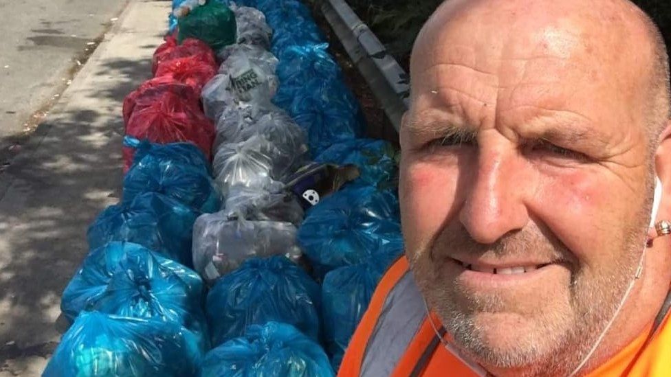 Scott Gibbins with the rubbish bags