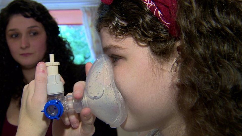Zona Armstrong uses her nebuliser as her mother Ayrin watches on