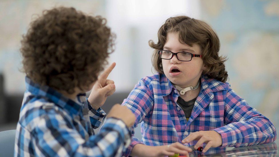 Two deaf children talking in sign language