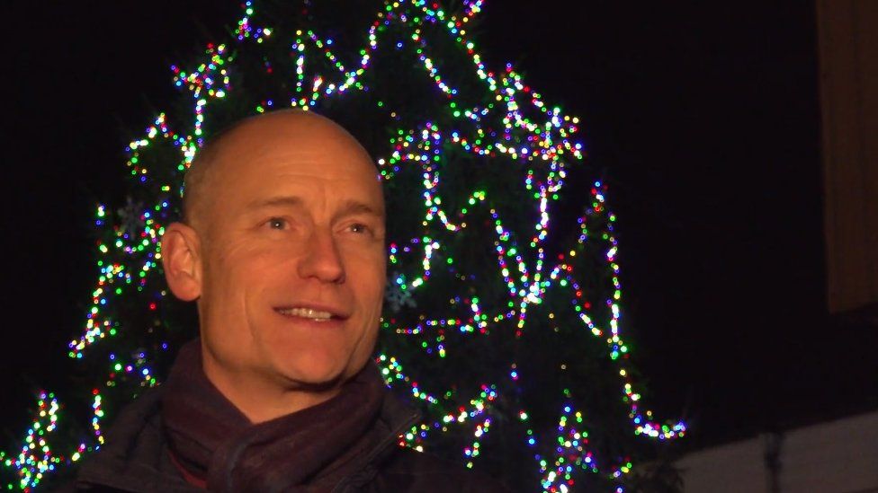 Stephen Kinnock in front of the decorated tree
