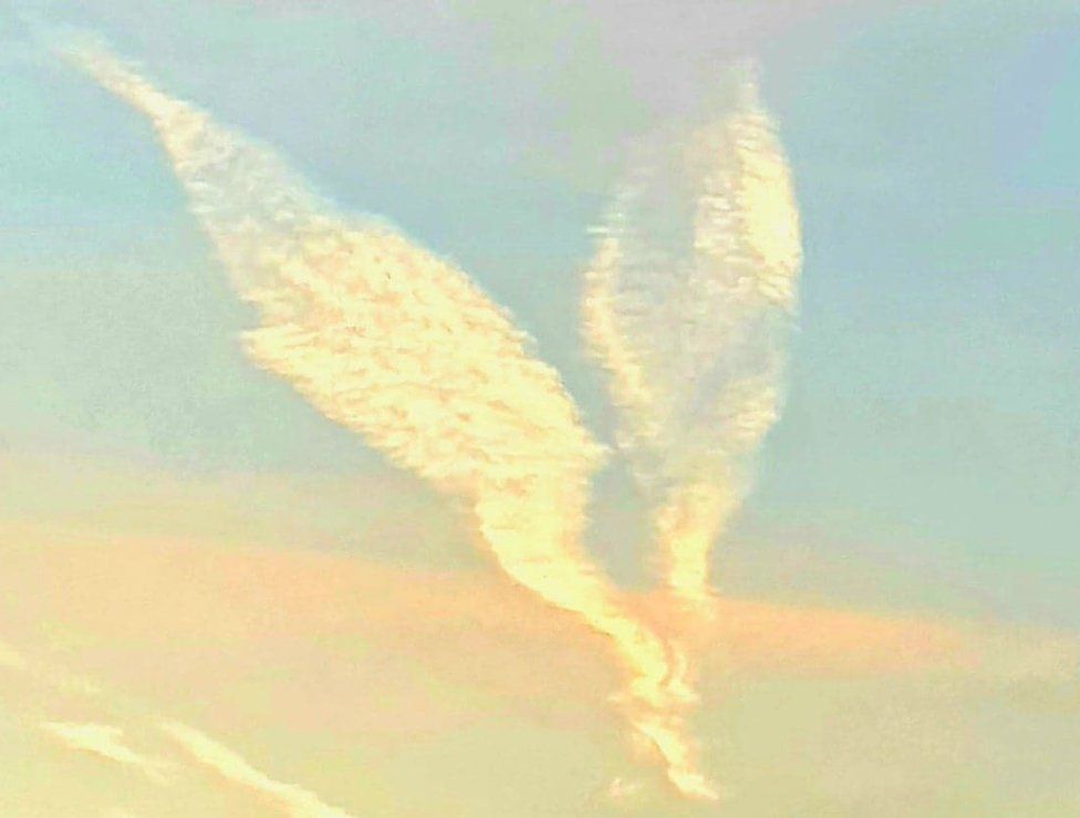 Contrails in the shape of angel wings