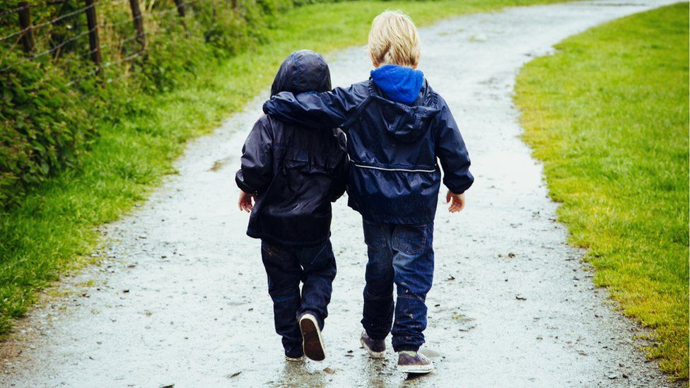 Two brothers walking