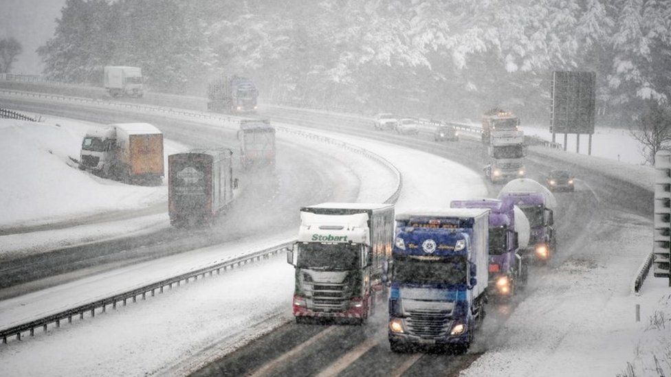 Vehicles travel down the M74, following motorist spending the night stranded on the motorway on January 17, 2018 in Abington, Scotland.