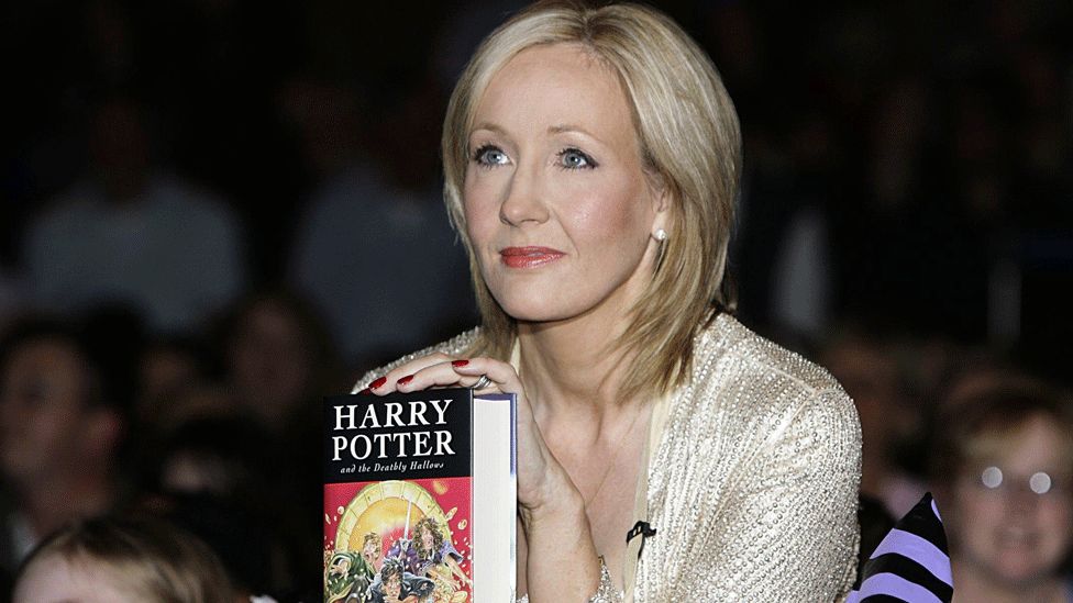 JK Rowling with Harry Potter book