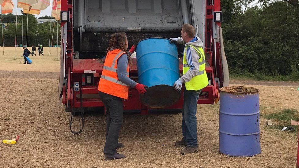 Volunteers loading rubbish onto a truck