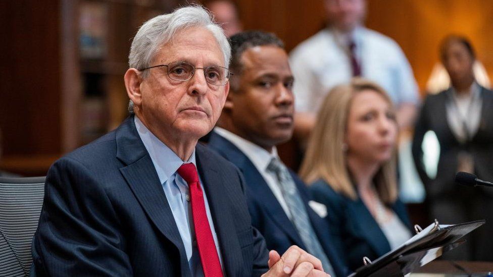 Attorney General Merrick Garland (L), with Assistant Attorney General Kenneth Polite (R), responds to a question on former President Donald J. Trump, following his remarks at a meeting with all of the US Attorneys to discuss violent crime reduction strategies at the Department of Justice in Washington, DC, USA, 14 June 2023.