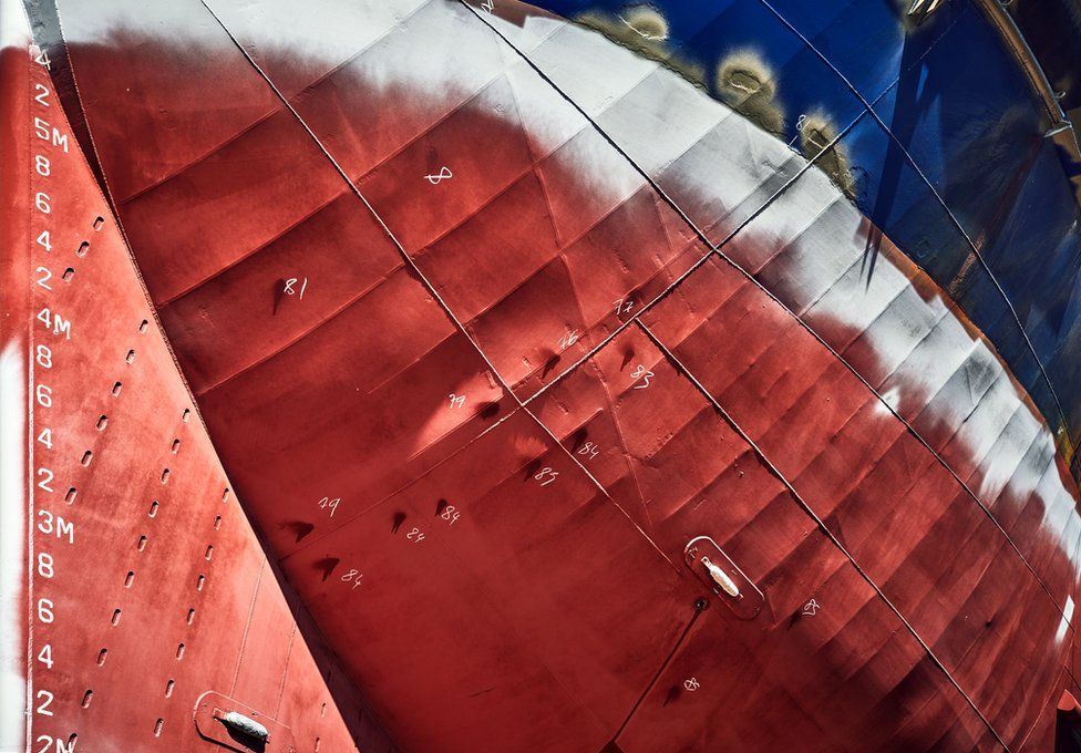 The underside of a ship in a dry dock