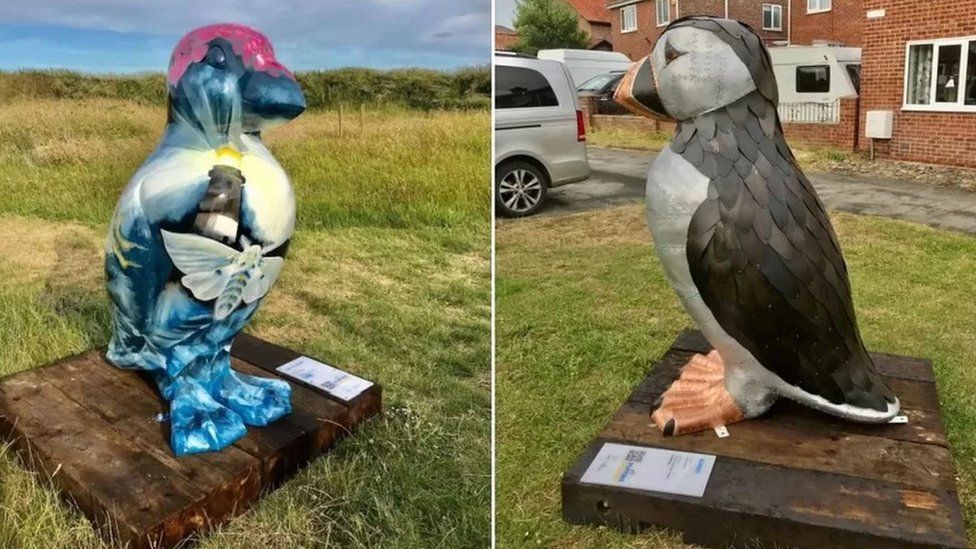 Two puffin sculptures