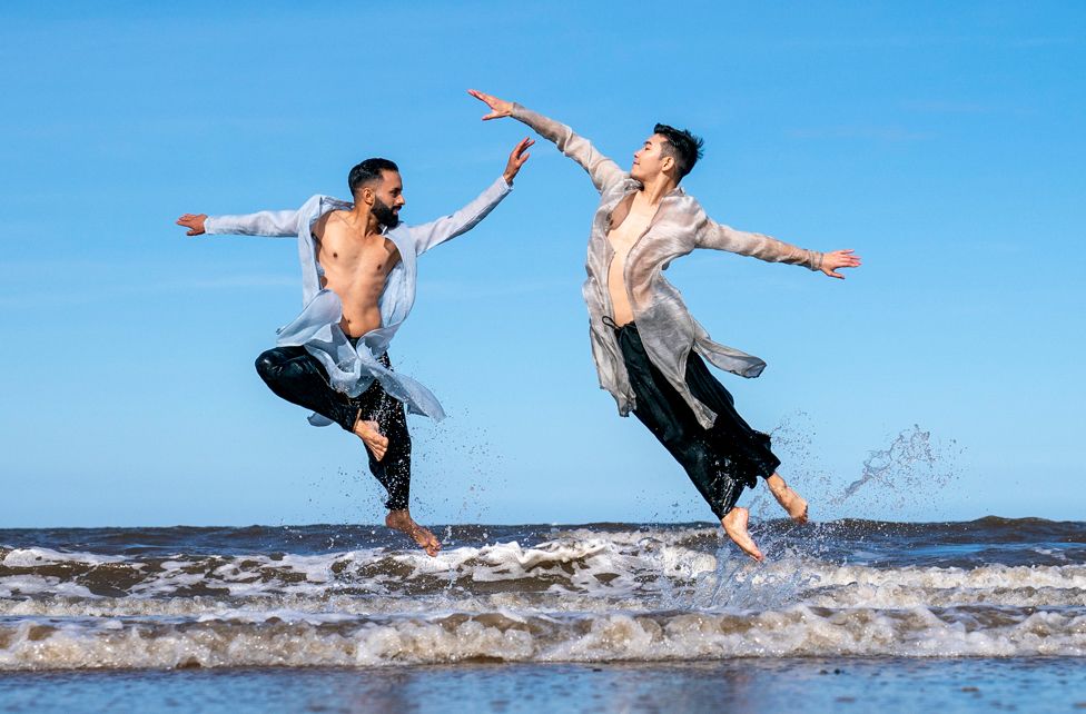 Aakash Odedra Company performers, Aakash Odedra and Hu Shenyuan dance selected extracts from their duet Samsara on Portobello Beach in Edinburgh during a media call for their performance at the Edinburgh International Festival. 17 August 2022