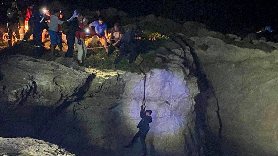 The Greek coastguard airlifted several people from the cliff face