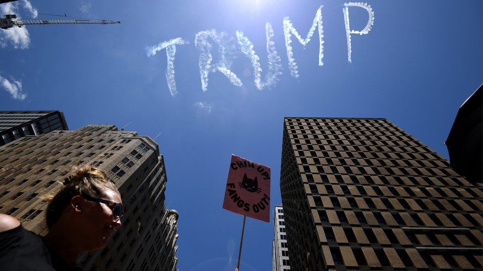 A view of the skywriting word reading "Trump" as thousands rally in support of equal rights in Sydney, New South Wales, Australia, 21 January 2017