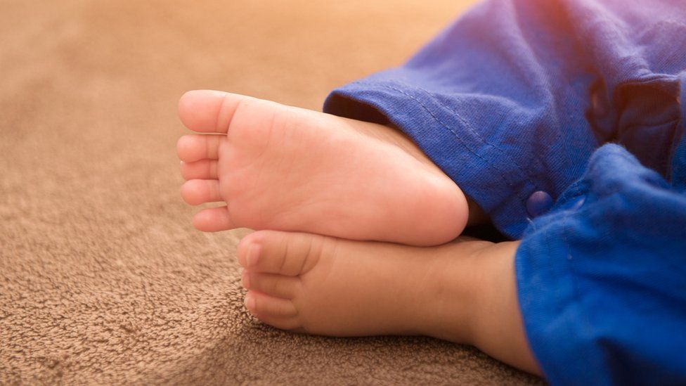 The feet of an Asian baby