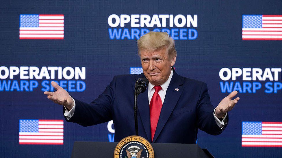 President Donald Trump greets the crowd before he leaves at the Operation Warp Speed Vaccine Summit on December 8, 2020