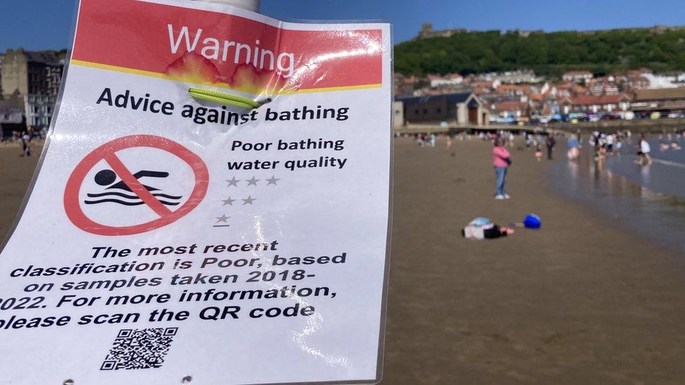 Sign on the beach in Scarborough