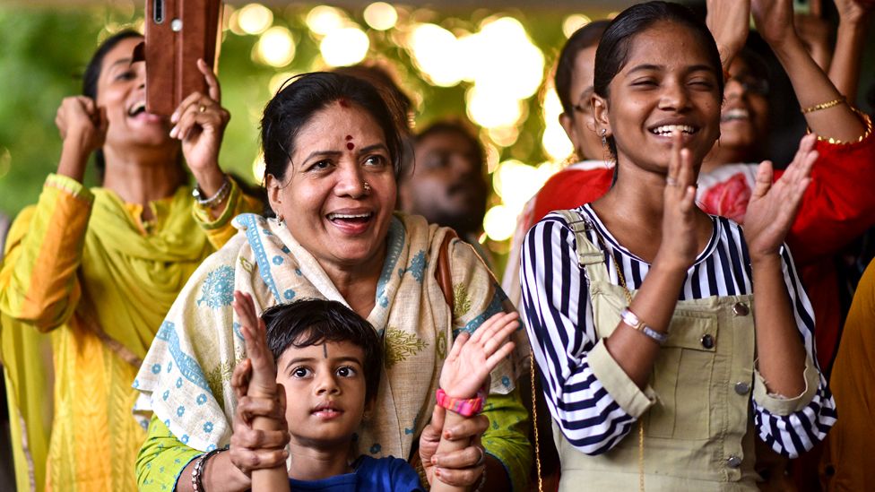 People react as they celebrate the soft landing of the Indian Space Research Organisation's mission Chandrayaan-3 on the Moon's South Pole during the live-streaming, at the Tamil Nadu Science and Technology Centre, in Chennai, India, on 23 August 2023