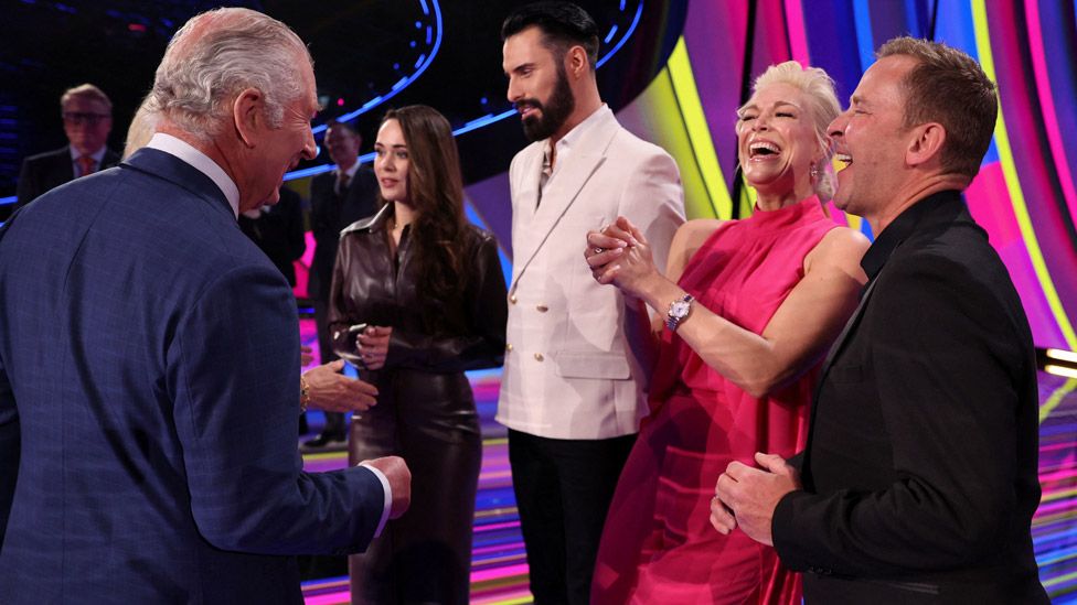 King Charles III and the Queen Consort meets the presenters of this year's Eurovision Song Contest, Scott Mills, Hannah Waddingham, Julia Sanina and Rylan Clark, during a visit to the M and S Bank Arena, the host venue of this year's Eurovision Song Contest. Picture date: Wednesday April 26, 2023