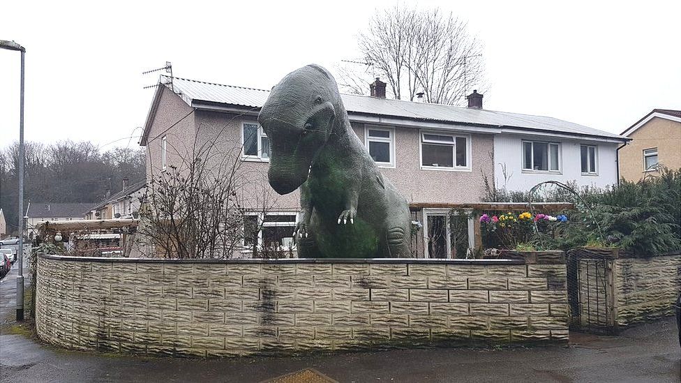 The dinosaur in the front garden