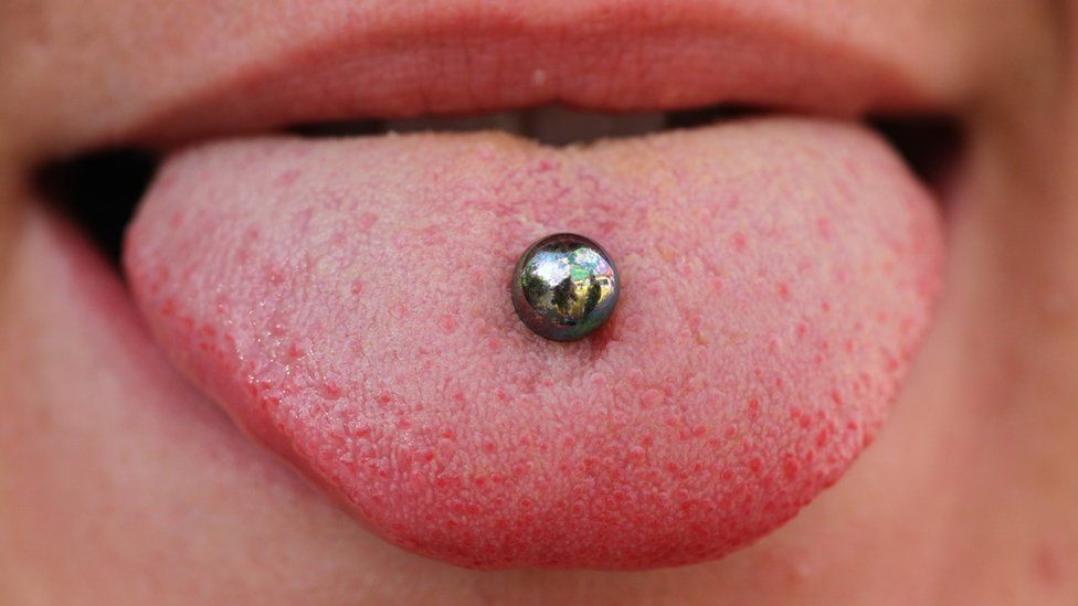 An authentic tongue piercing